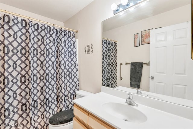 bathroom with vanity and toilet