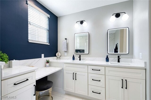 bathroom with tile patterned flooring and vanity