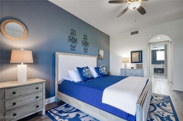 bedroom featuring dark hardwood / wood-style flooring and ceiling fan