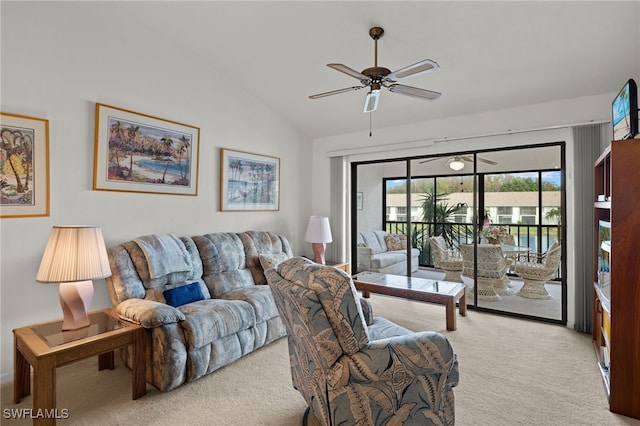 carpeted living room featuring ceiling fan and lofted ceiling