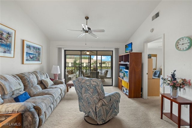 living room featuring ceiling fan, light carpet, and lofted ceiling