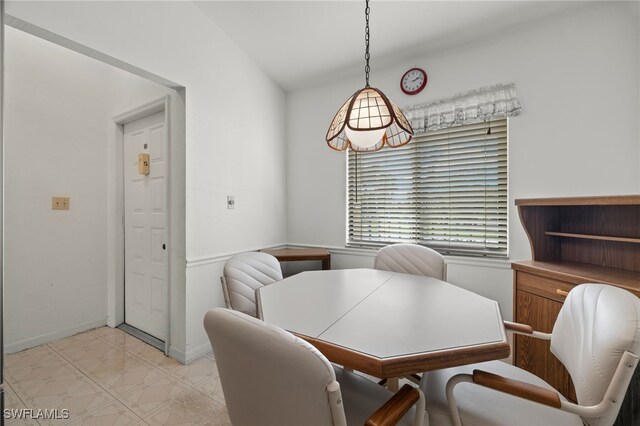 dining space featuring baseboards