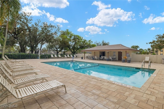 view of swimming pool with a patio