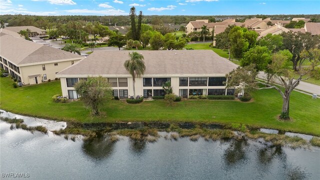 birds eye view of property with a residential view and a water view