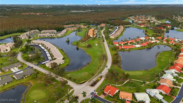 aerial view featuring a residential view, a water view, and golf course view