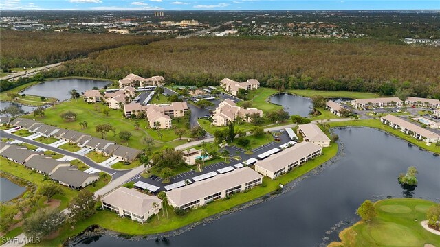 drone / aerial view featuring a water view and a residential view