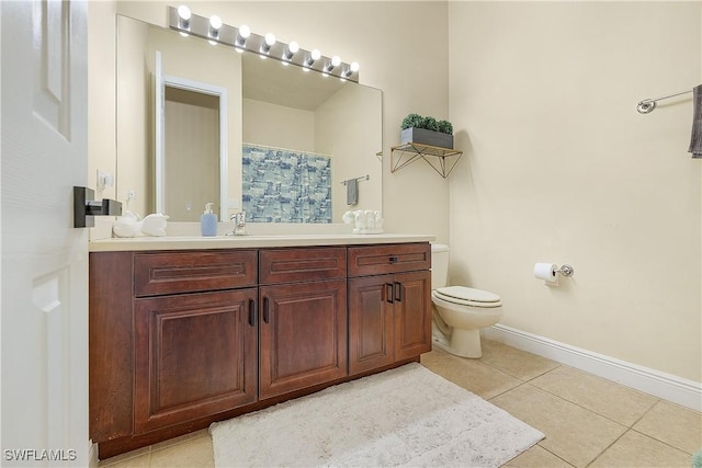 bathroom featuring toilet, a shower with shower curtain, vanity, and tile patterned floors