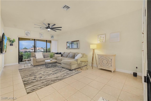 living room featuring ceiling fan and light tile patterned floors