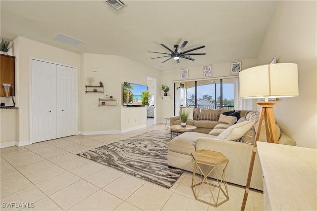 living room with tile patterned flooring and ceiling fan