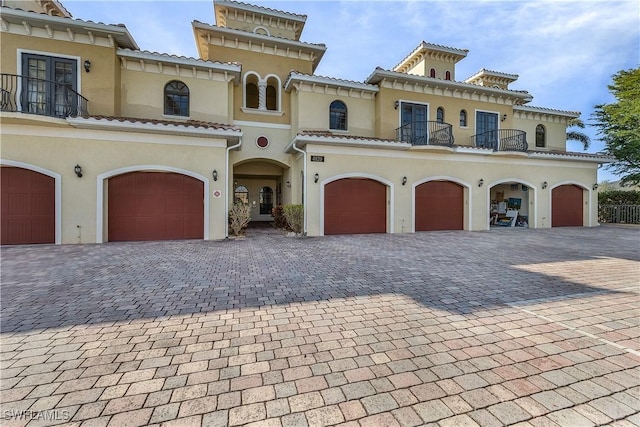 mediterranean / spanish-style house featuring a garage