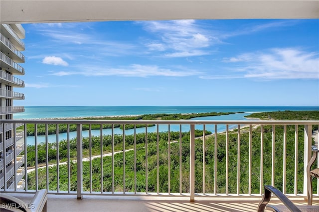 balcony featuring a water view