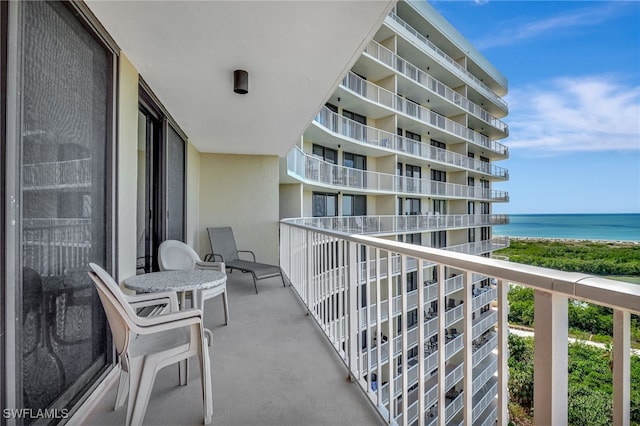 balcony featuring a water view