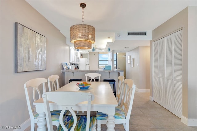 dining area featuring light tile patterned floors