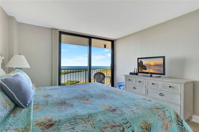 carpeted bedroom with access to outside and floor to ceiling windows