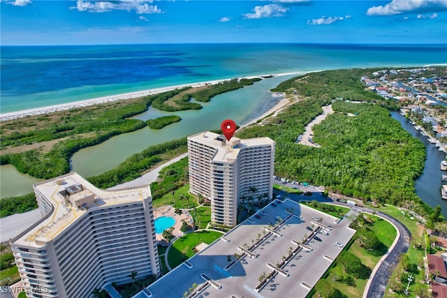 bird's eye view featuring a view of the beach and a water view