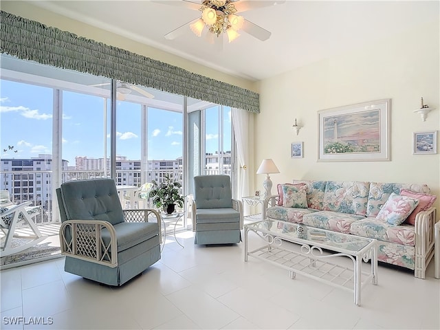 tiled living room with ceiling fan and plenty of natural light