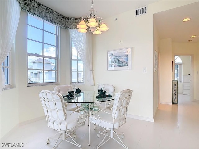22700 Island Pines Way Unit 503, Fort Myers Beach, FL 33931 - dining area with a chandelier, healthy amount of natural light, baseboards, and recessed lighting
