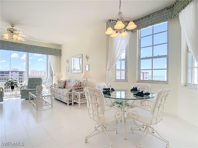 22700 Island Pines Way Unit 503, Fort Myers Beach, FL 33931 - tiled dining space with a chandelier, plenty of natural light, and baseboards