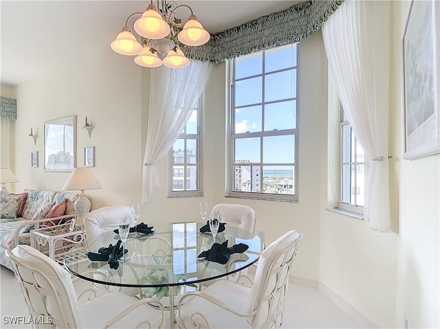 22700 Island Pines Way Unit 503, Fort Myers Beach, FL 33931 - dining area featuring a chandelier and baseboards