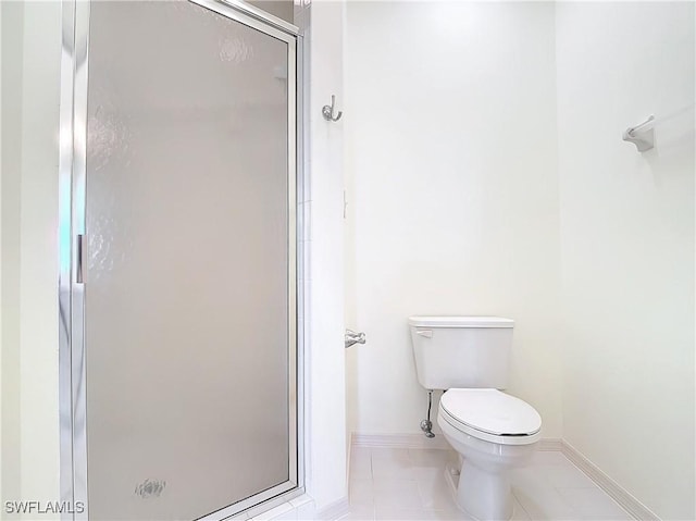 22700 Island Pines Way Unit 503, Fort Myers Beach, FL 33931 - bathroom with a stall shower, tile patterned floors, baseboards, and toilet