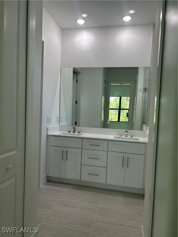 bathroom with vanity and tile patterned flooring