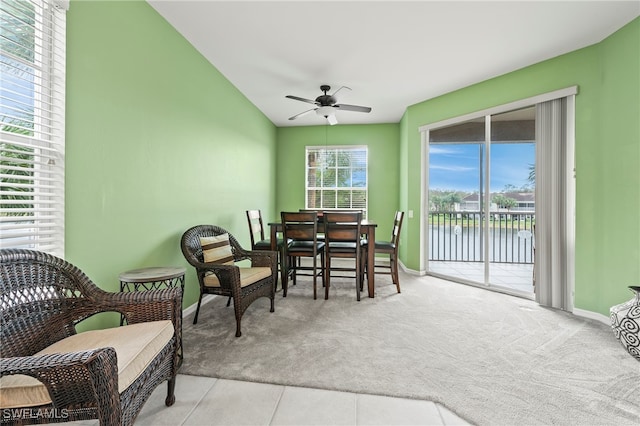 sunroom with a water view, ceiling fan, and lofted ceiling