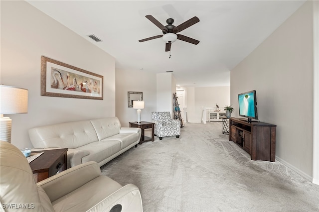 living room with light carpet and ceiling fan