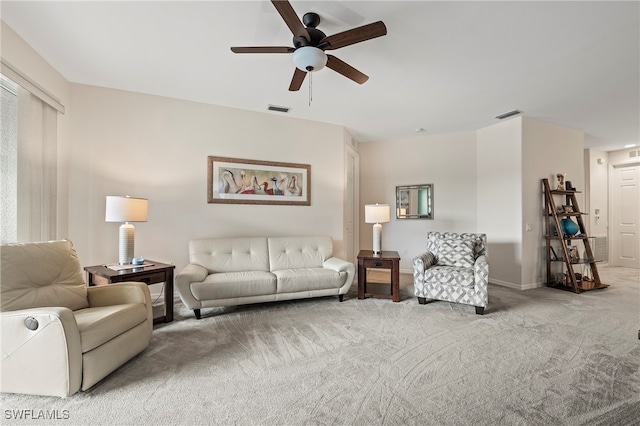 living room with carpet and ceiling fan