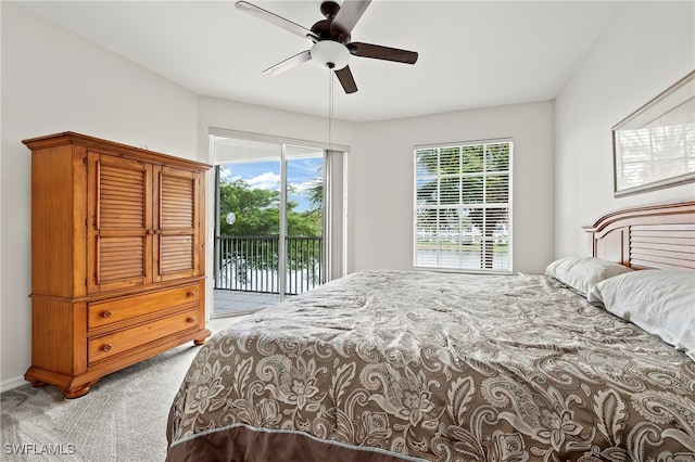 bedroom with ceiling fan, light carpet, and access to outside