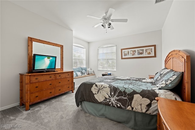 bedroom with light colored carpet and ceiling fan