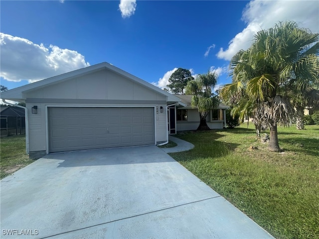 ranch-style home with a garage and a front lawn