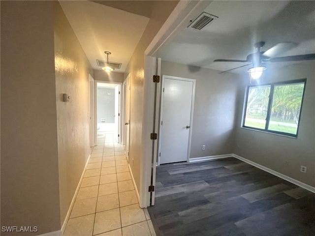 hall with tile patterned flooring