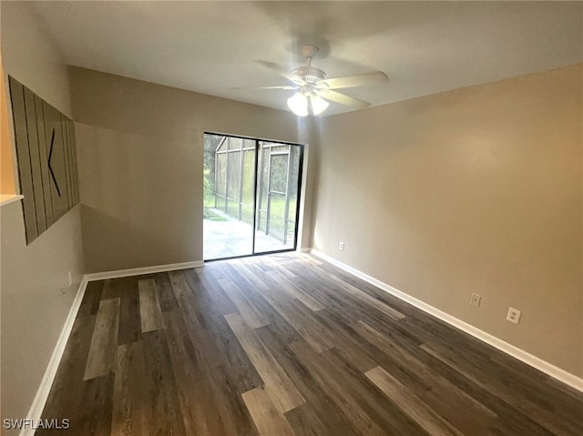 empty room featuring ceiling fan and dark hardwood / wood-style floors