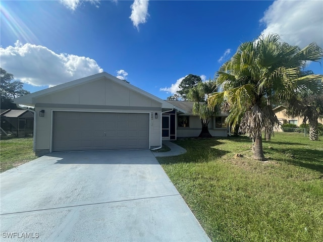 view of front of property featuring a garage and a front yard