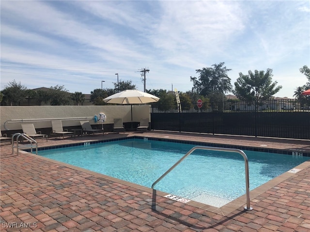 view of swimming pool with a patio area