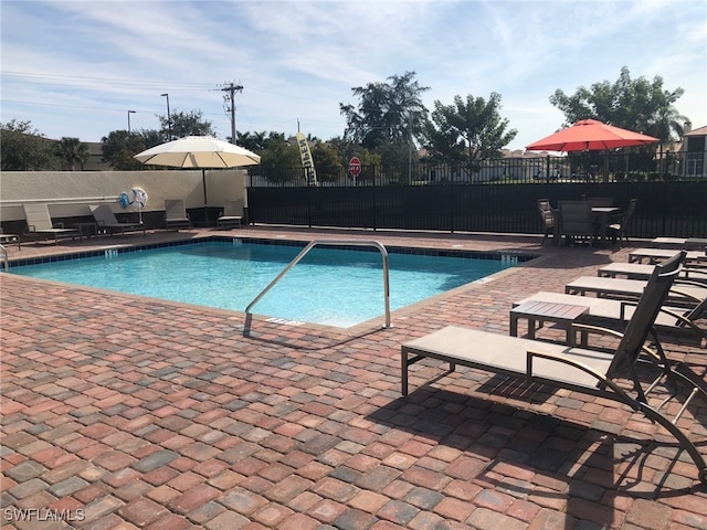 view of swimming pool featuring a patio area