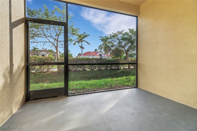 unfurnished sunroom with plenty of natural light