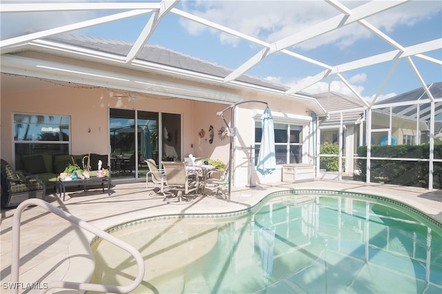 view of pool with a lanai and a patio area