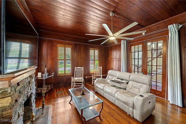 living room with hardwood / wood-style floors, wooden ceiling, and plenty of natural light