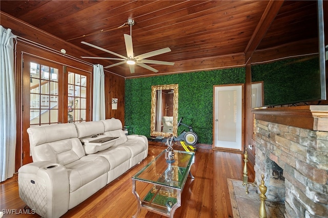 living room with a stone fireplace, french doors, wood ceiling, hardwood / wood-style flooring, and ceiling fan