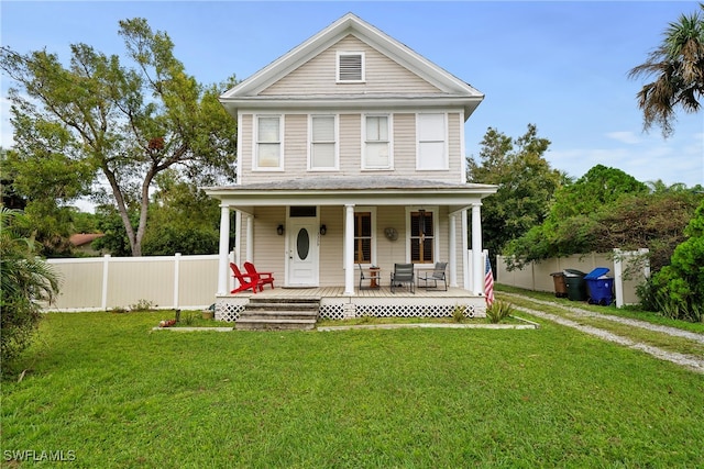 view of front of house with a front lawn and covered porch