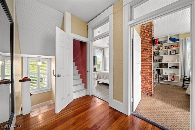 hallway featuring hardwood / wood-style floors and plenty of natural light