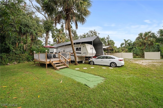 exterior space with a yard and a wooden deck