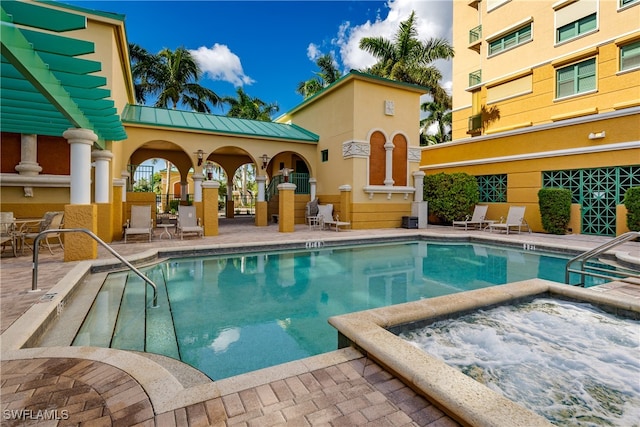 view of swimming pool with a patio