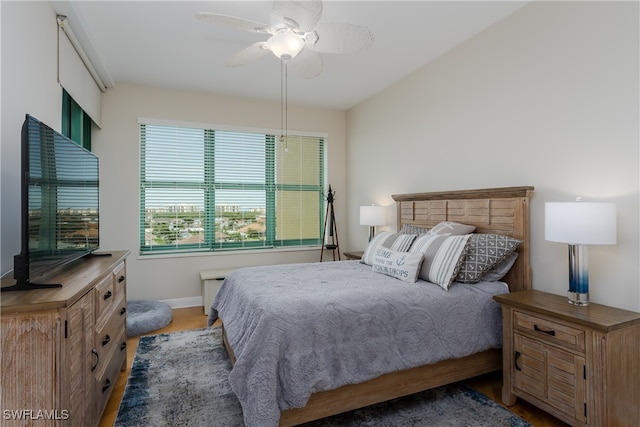 bedroom featuring hardwood / wood-style floors and ceiling fan