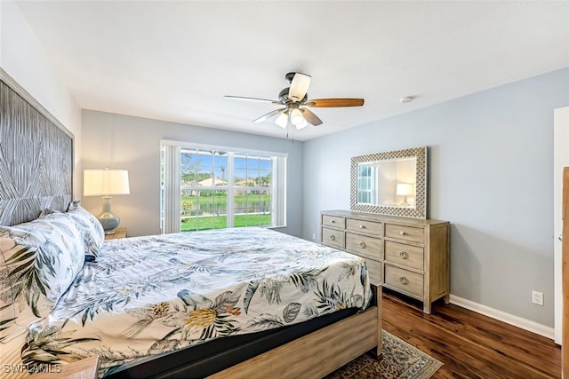 bedroom featuring ceiling fan and dark hardwood / wood-style floors