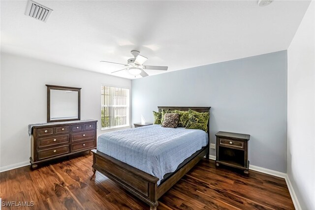 bedroom featuring dark wood-type flooring and ceiling fan