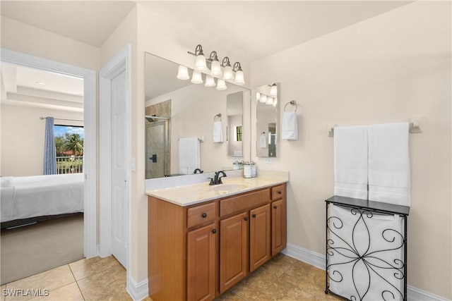 bathroom with tile patterned flooring, vanity, and an enclosed shower