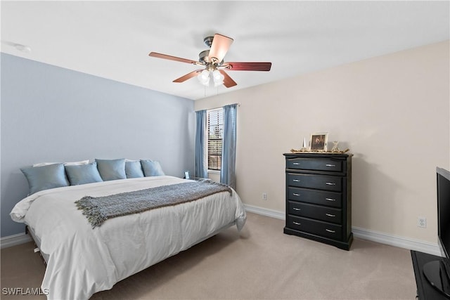 bedroom with ceiling fan and light colored carpet