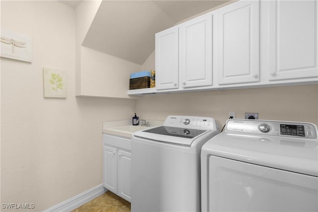 laundry room featuring separate washer and dryer, sink, and cabinets